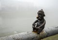 Mini sculpture of Celt on the embankment of the river Latoritsa in rainy weather