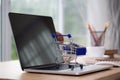 Mini shopping cart on computer laptop. Business concept. Royalty Free Stock Photo