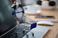 Mini shopping cart on computer laptop. Business concept. Royalty Free Stock Photo