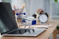 Mini shopping cart on computer laptop. Business concept. Royalty Free Stock Photo