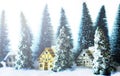 Mini snowy Christmas trees with houses in the forest. Bokeh lights background Royalty Free Stock Photo