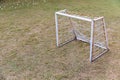 Mini Soccer goal on the green grass field. Outdoors mini football court. Mini football goal Royalty Free Stock Photo