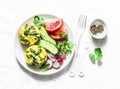 Mini spinach cheddar frittata and vegetables salad on light background, top view. Breakfast table flat lay