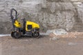 A mini steamroller at a road construction site Royalty Free Stock Photo