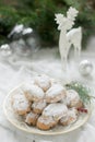 Mini Stollen or Stollen candy in the background with a deer figure, Christmas balls and fir branches. Royalty Free Stock Photo