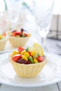 Mini tart with salad from sweet corn, kidney beans and avocado salad on festive table