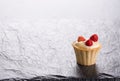 Mini tartlet with custard and fresh wild strawberries.