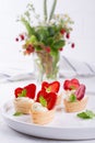 Mini tartlets on the plate . Homemade dessert with delicious cream cheese and berries Royalty Free Stock Photo