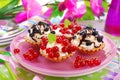 Mini tartlets with whipped cream and fresh fruits Royalty Free Stock Photo