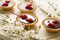 Mini tarts with chocolate and cherries decorated cherry blossom