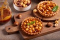 Mini tarts with hazelnuts and caramel cream filling