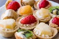 Mini Tarts, Tartolet or Tartlets with cream and fresh fruit Royalty Free Stock Photo