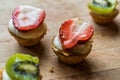 Mini Tarts, Tartolet or Tartlets with Strawberry, Cream and fresh fruits. Royalty Free Stock Photo