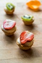 Mini Tarts, Tartolet or Tartlets with Strawberry, Cream and fresh fruits. Royalty Free Stock Photo