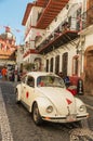 Mini taxi against the Cathedral of Taxco, Mexico.