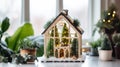 Mini tiny Christmas greenhouse in white room. Christmas terrarium with fir trees, moss, lights, mini houses, berries. Shop Glass