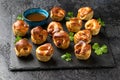 Mini Toad in the hole, Baked sausages in Yorkshire pudding with gravy Royalty Free Stock Photo