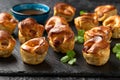 Mini Toad in the hole, Baked sausages in Yorkshire pudding with gravy Royalty Free Stock Photo