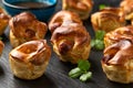 Mini Toad in the hole, Baked sausages in Yorkshire pudding with gravy Royalty Free Stock Photo