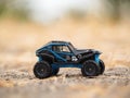 Mini toy  of action figure at outdoor with blurred background. Rally car concept design. Royalty Free Stock Photo
