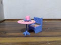 Mini toy table chair and tea cup Royalty Free Stock Photo