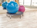 Mini trampoline with exercise balls in modern fitness studio Royalty Free Stock Photo