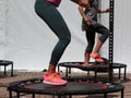 Mini Trampoline Workout: Girl doing Fitness Exercise in Class at