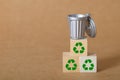 Mini Trash Can on Recycling Blocks \' Concept of Eco-Friendly Waste Management Royalty Free Stock Photo