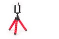 Mini tripod with flexible red legs and mobile phone holder