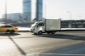 mini truck Hyundai Porter driving through highway with blurred urban background. Popular small cargo vehicle in motion