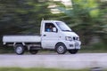 Mini truck panning camera in road