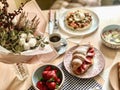 Mini tuna pizza and croissant with strawberry.. Breakfast homemade.