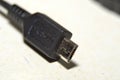 Mini USB power adapter, close up photo tip to connect the phone. Royalty Free Stock Photo