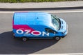 Mini van truck for delivery to points of delivery of the online store Ozon.ru rushing rides highway city road. Russia, Saint-