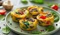 Mini vegetable frittatas with spinach and mushrooms on a pastel green plate Royalty Free Stock Photo