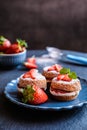 Mini Victoria sponge cakes with whipped cream and strawberries Royalty Free Stock Photo