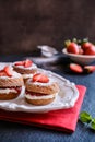 Mini Victoria sponge cakes with whipped cream and strawberries Royalty Free Stock Photo