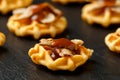 Mini waffle duck party food on rustic stone background