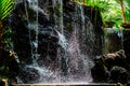 Mini waterfall at the garden for relaxation as a decoration in o Royalty Free Stock Photo