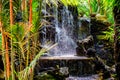 Mini waterfall at the garden for relaxation as a decoration in o Royalty Free Stock Photo