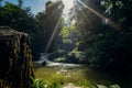 Mini waterfall and sunset sunny beams, travel destinations background, Forest viwe river Kroeng Krawia Waterfall, Kanchanaburi,