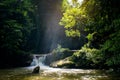 Mini waterfall and sunset sunny beams, travel destinations background, Forest viwe river Kroeng Krawia Waterfall, Kanchanaburi, Royalty Free Stock Photo