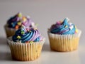 MIni white cupcake with blue and purple frosting Royalty Free Stock Photo