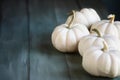 Mini White Pumpkins on Rustic Blue Green Table for Autumn