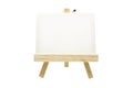 Mini wooden easel with blank canvas frame isolated