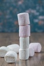 Mini yummy marshmallows on a wooden table Royalty Free Stock Photo