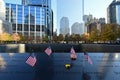 Miniature American flags and flowers at World Trade Center Memorial in New York. Royalty Free Stock Photo