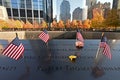 Miniature American flags and flowers at World Trade Center Memorial in New York. Royalty Free Stock Photo