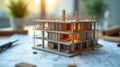 Miniature Architectural Model on Construction Blueprint Surface Royalty Free Stock Photo