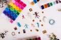 Miniature beaded toys, wire and boxes with colorful beads on a table top view Royalty Free Stock Photo